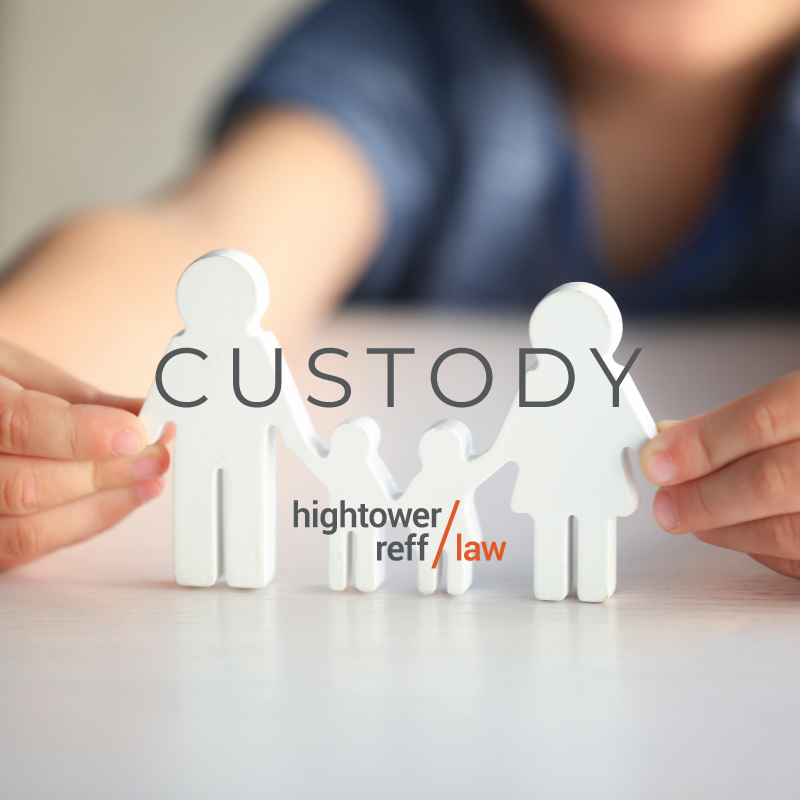Custody - a paper cutout of a family